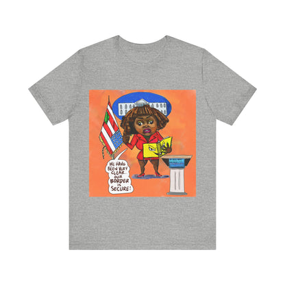 Orange Binder Lady Musobia political satire artwork on gray T-shirt